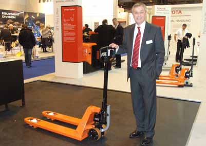 Mike Mathias, Managing Director of Toyota Material Handling UK, with the company's BT Pro Lifter, which scooped the prize as overall winner in the IMHX Design 4 Safety Awards