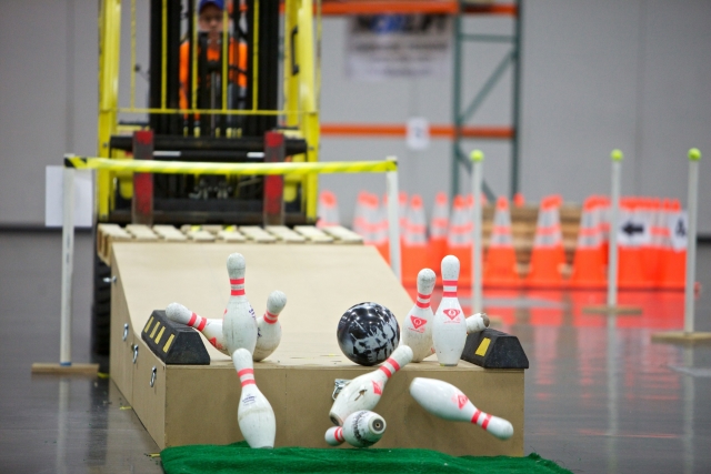 Contestants aim for a strike in the exciting Forklift Bowling event at the GOSH Conference. Photo: Mitchell Dyer Photography.