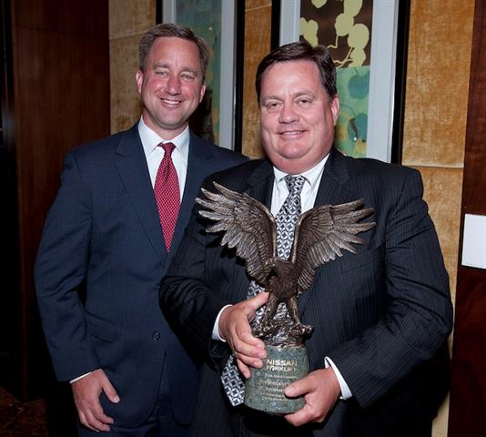 Nissan's Peter Kruse, left, with Audie Burgan of JM Equipment