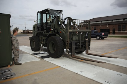 An all-terrain 5-T. forklift rolls over scale to get weight before air evacuation.<br />PHOTO: US Air Force/2nd Lt David J Murphy