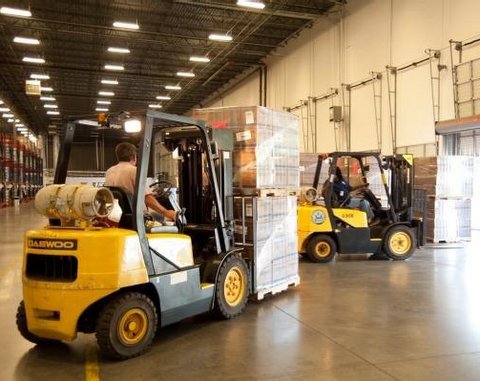 Forklifts help in the relief operation.